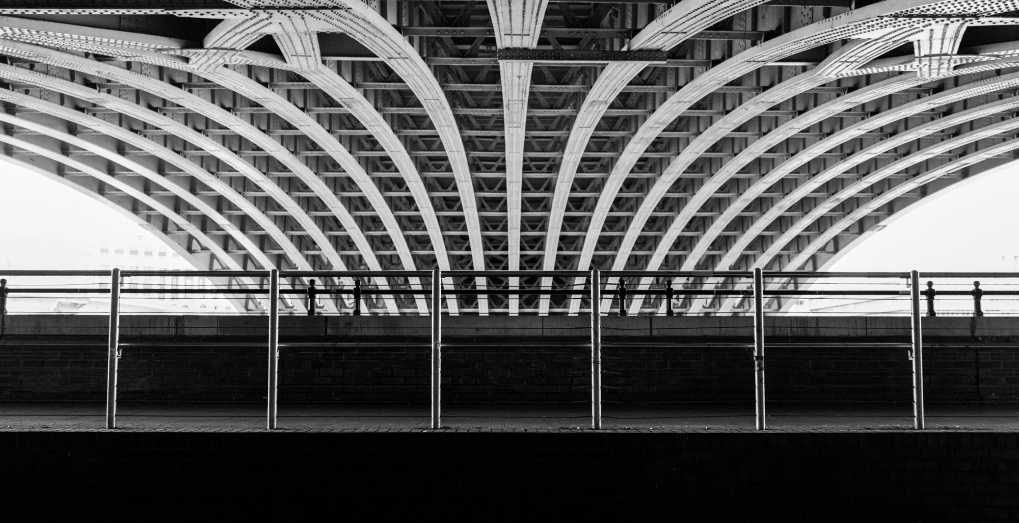 Riveted arch ribs beneath a bridge — photograph by Don Gillikin